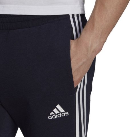 Spodnie adidas Essentials Tapered Cuff 3 Stripes M GK8977 Adidas