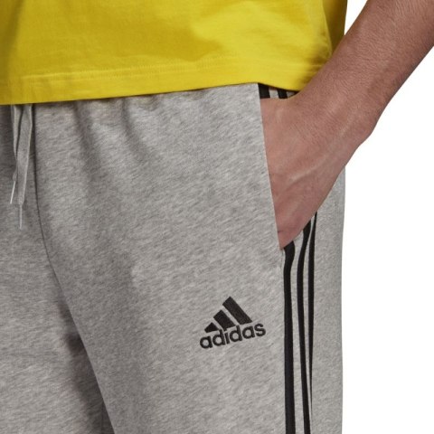 Spodnie adidas Essentials Tapered Cuff 3 Stripes M GK8889 Adidas