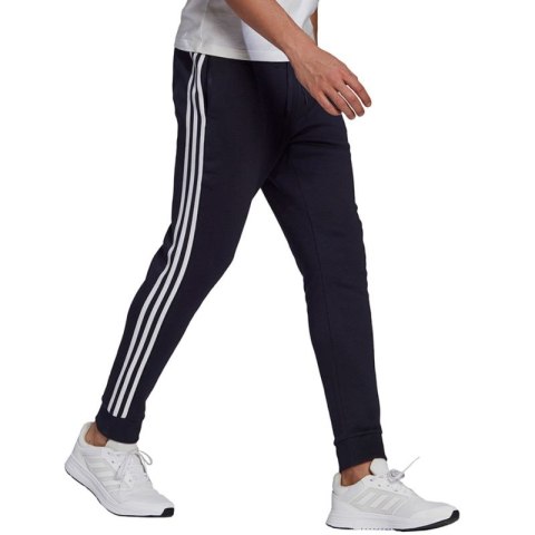 Spodnie adidas Essentials Fleece Tapered Cuff 3-Band M GK8823 Adidas