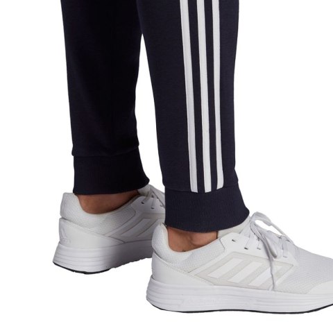 Spodnie adidas Essentials Fleece Tapered Cuff 3-Band M GK8823 Adidas